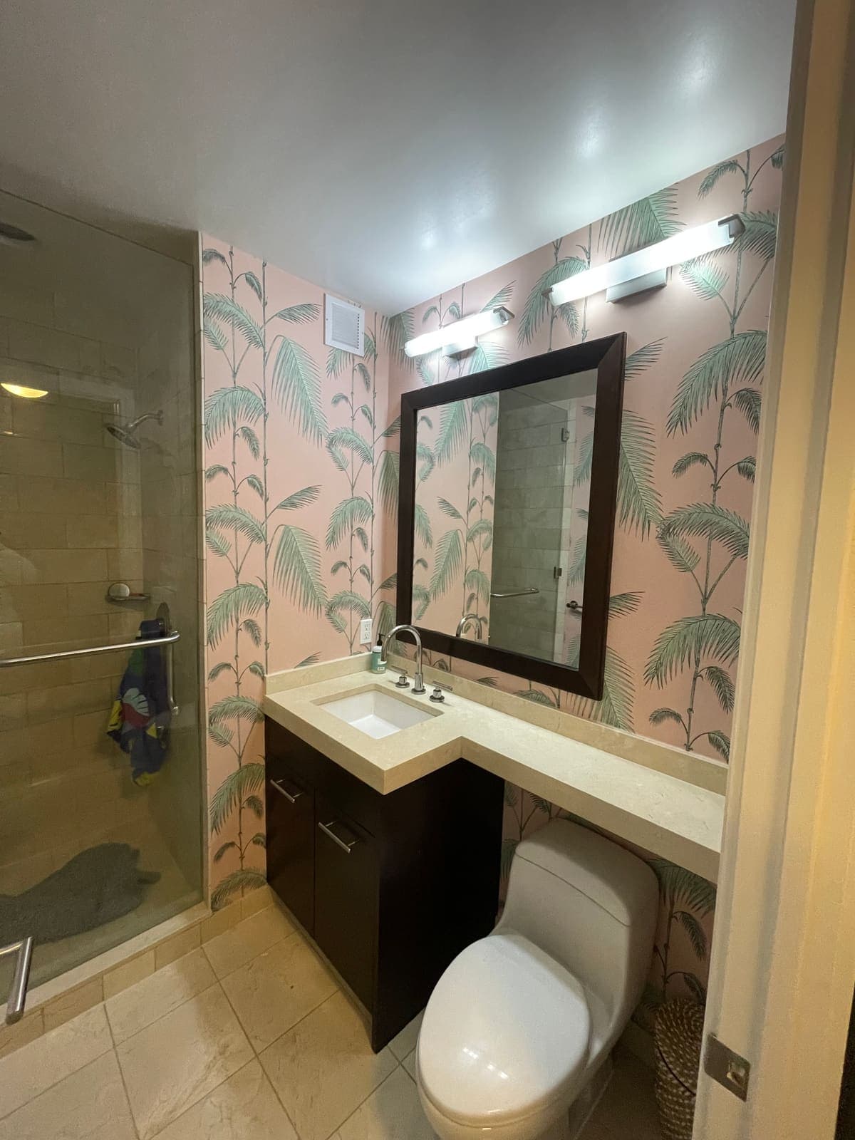 Palm-print wallpaper installed in a Philadelphia bathroom
