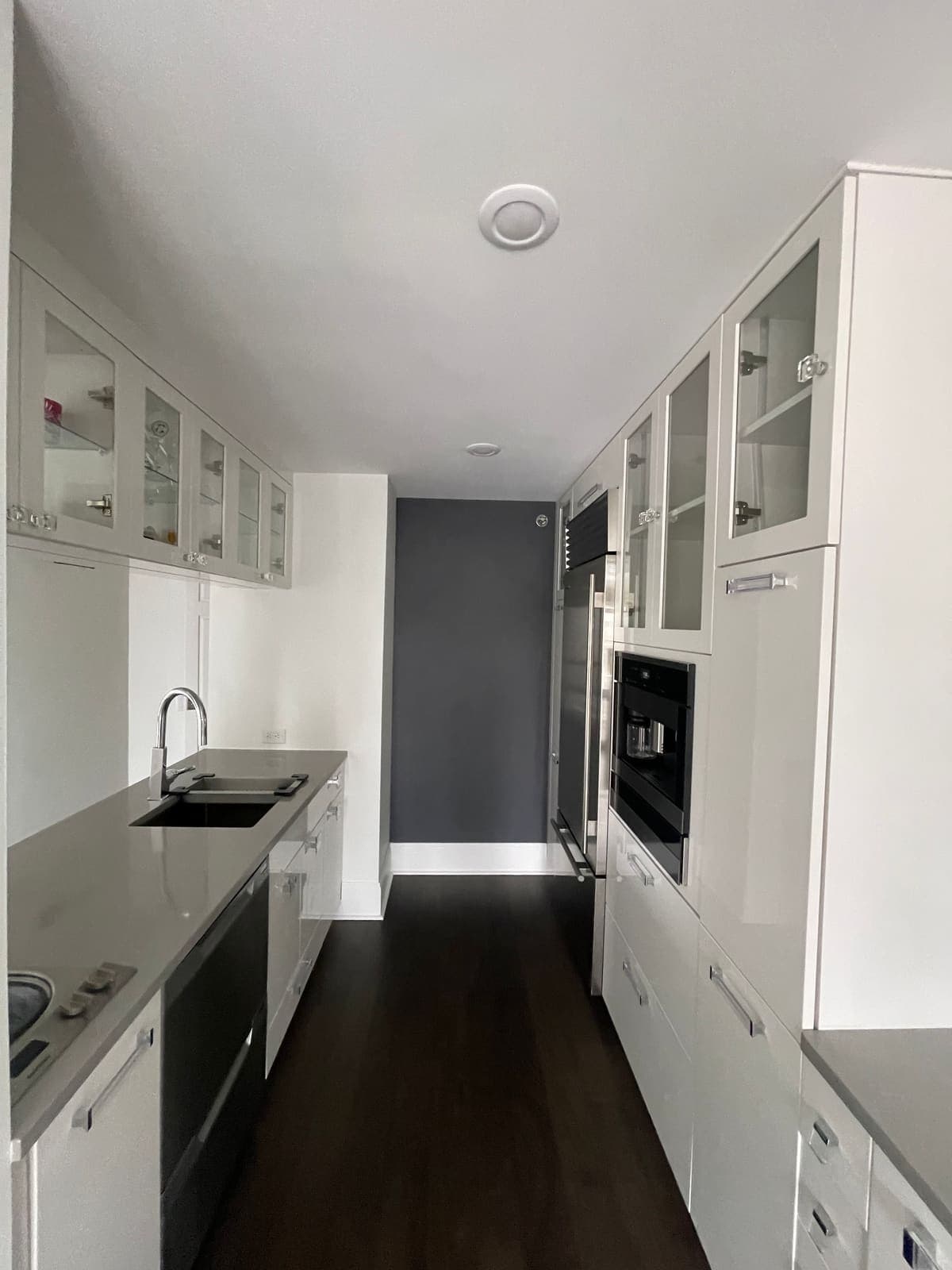Painted white kitchen cabinets in a Philadelphia galley kitchen