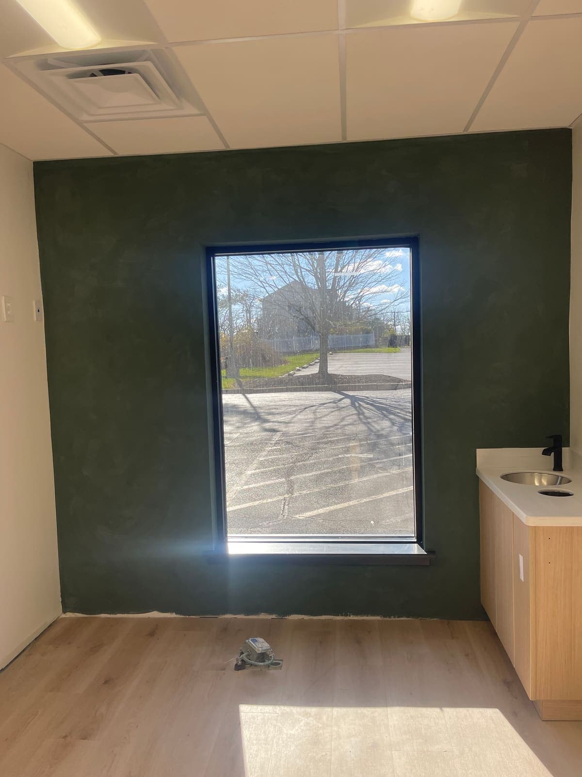 Deep green accent wall painted in a Philadelphia commercial office