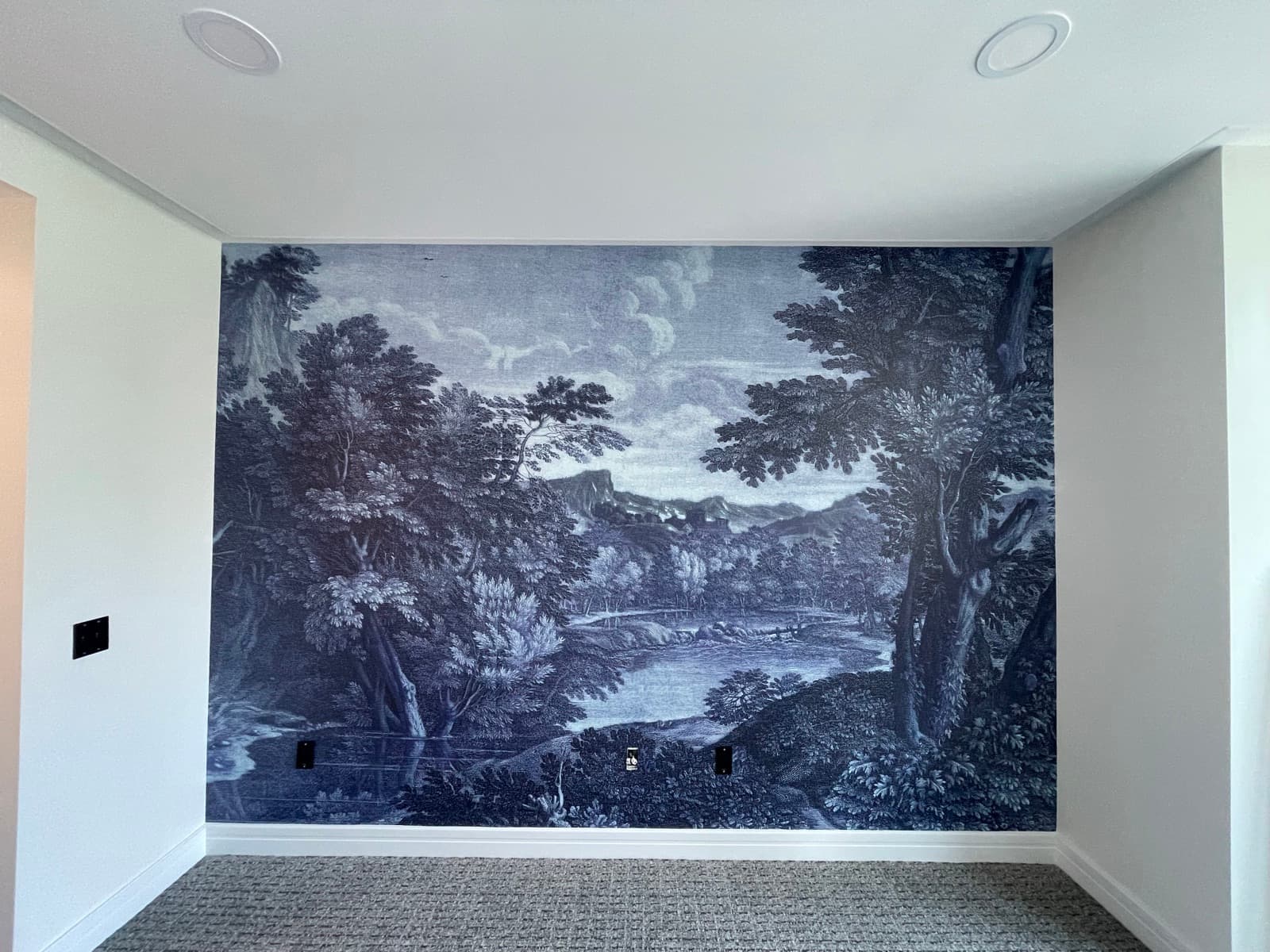 Navy scenic toile mural wallpaper installed on a Philadelphia accent wall